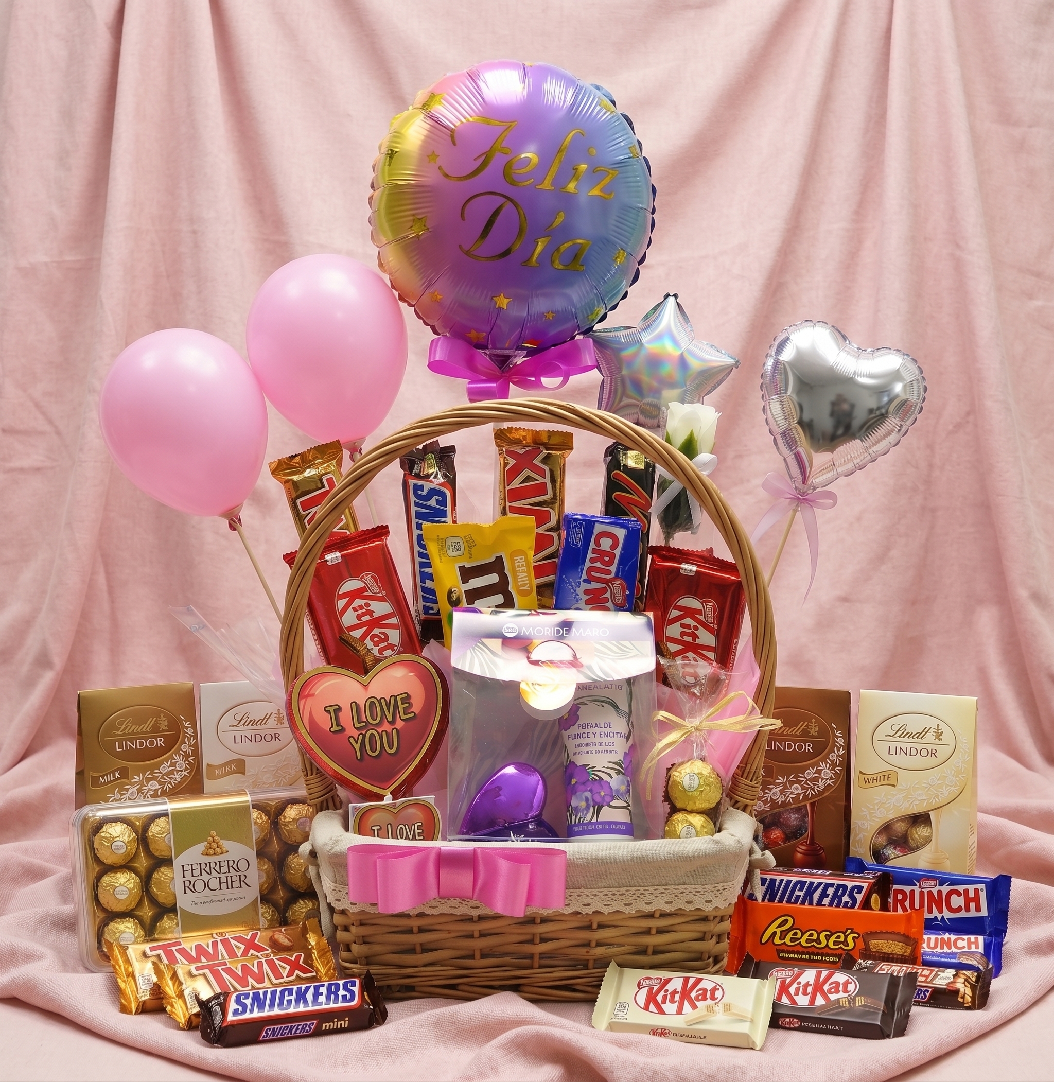 Canasta de regalo con chocolates finos Ferrero, Lindt y globos de helio